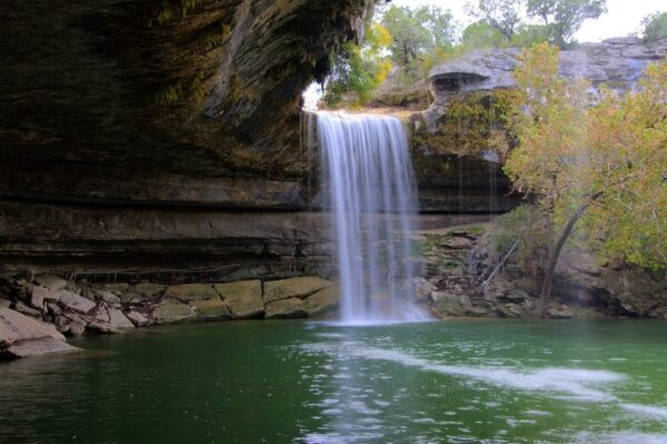 Water fall into a limestone grotto in the Texas Hill Country
