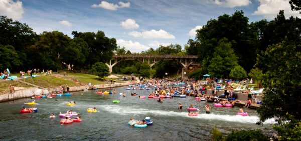 Constant 70 degree, slow moving Comal River is perfect for tubing and relaxing.