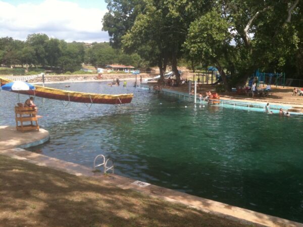 An excursion on a paddle boat is one of the best ways to see the Comal Springs and Landa Lake.
